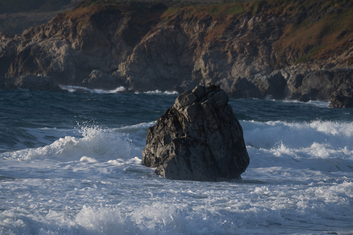 Waves crashing against Lone Rock in Big Sur California